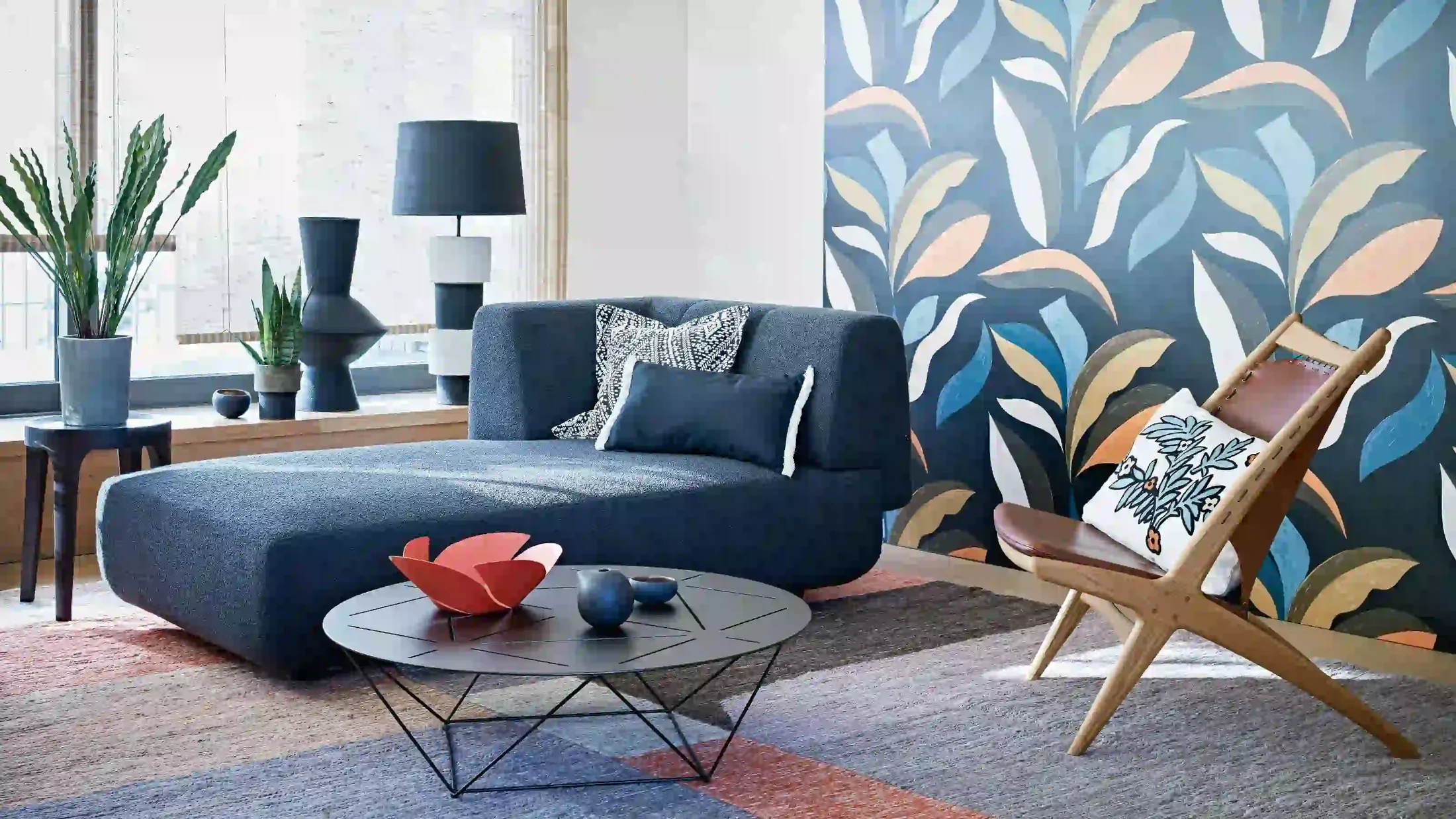 Contemporary living room with a bold botanical wallpaper wall